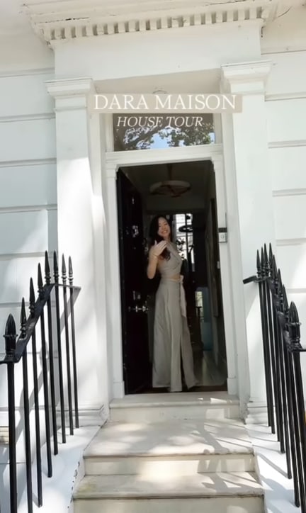Dara Huang outside her white brick townhouse