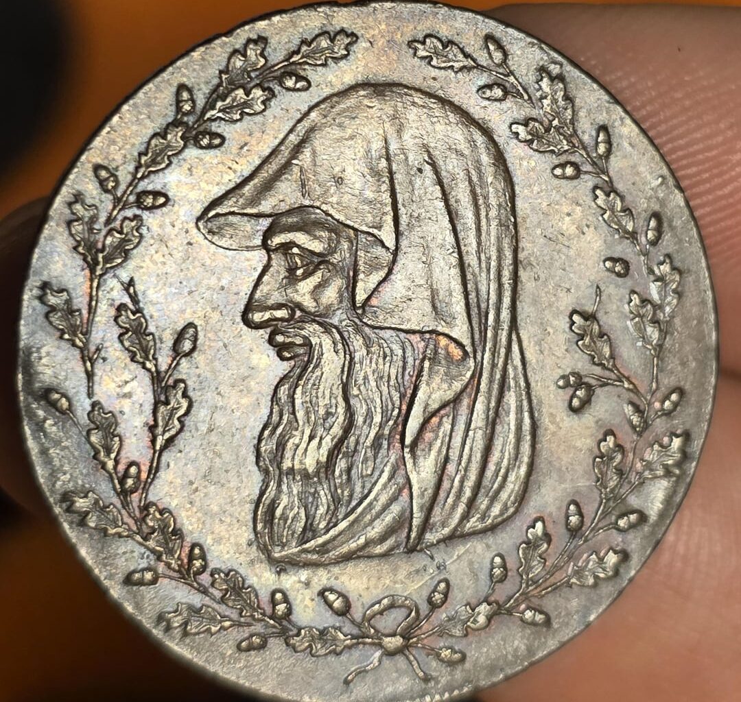 Old Welsh coin with a druid