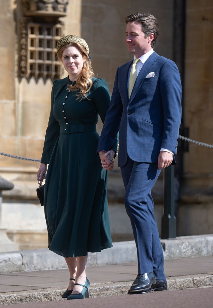 Princess Beatrice walks hand-in-hand with her husband Edoardo Mapelli Mozzi at Windsor Castle, wearing a green Beulah London dress and Mary Jane heels, paired with a gold headband and black Chanel bag.