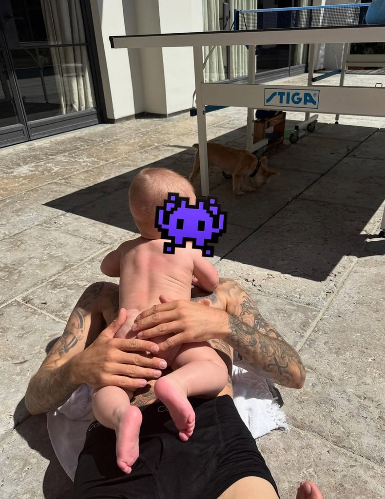 Photo shared by Justin Bieber on Instagram March 2025 of his son Jack Blues laying naked on his chest on the floor