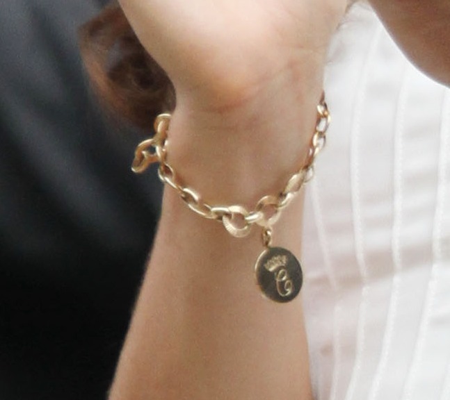 Kate Middleton clapping at a Wimbledon tennis match.