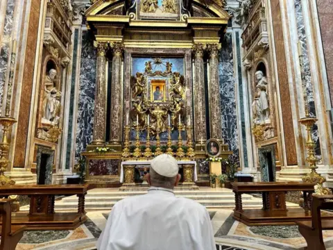 Reuters Pope Francis praying in front of an icon of the Virgin Mary during a visit to the Santa Maria Maggiore in June 2023