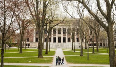 Pedestrians walk through Harvard Yard on the Harvard University campus in Cambridge, Massachusetts.