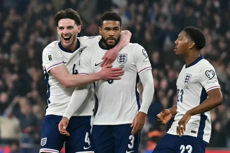 England's Reece James (C) celebrates scoring against Latvia (Glyn KIRK)