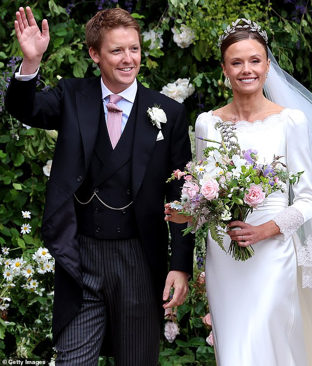 NEWLYWEDS: Hugh Grosvenor, Duke of Westminster and Olivia Grosvenor, Duchess of Westminster, wave to well-wishers following their wedding at Chester Cathedral