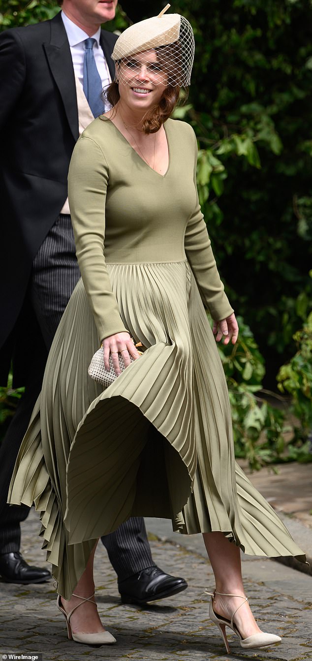 Princess Eugenie wore a different outfit for the ceremony (pictured), opting for a midi length olive-coloured frock and cream fascinator