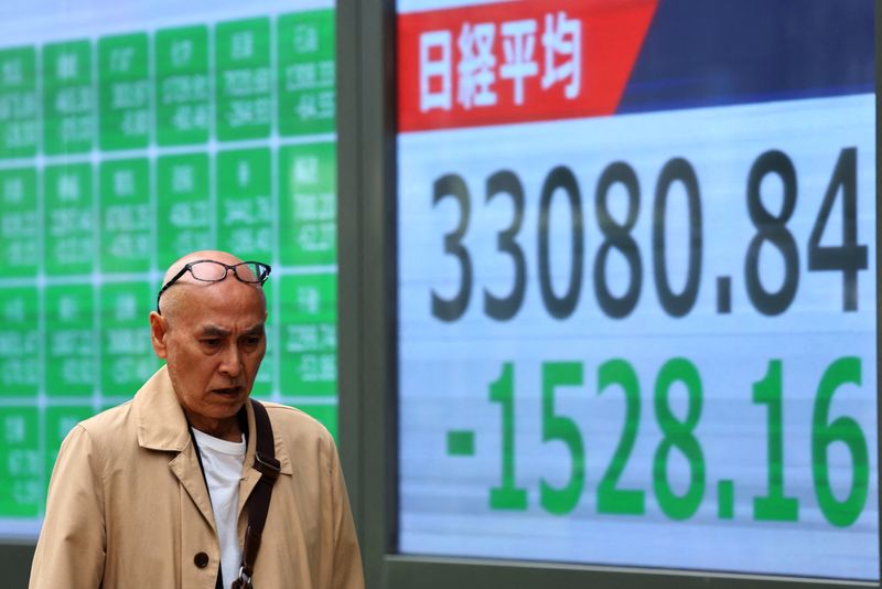 Japan's Nikkei slumps on trade war worries, stronger yen