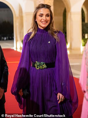 Queen Rania wore a deep purple dress with the same high neck and balloon sleeves  at the Al Husseiniya Palace in 2022