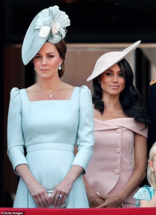 Kate Middleton was 'much stronger' than Meghan, according to Palace staff. Pictured together on the balcony of Buckingham Palace during Trooping The Colour in 2018