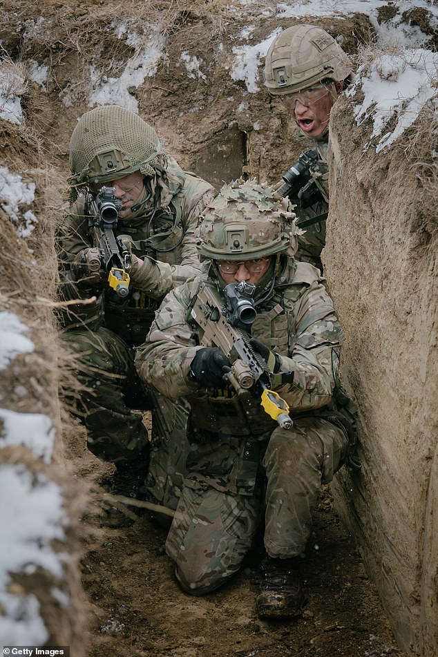 The alliance is reportedly launching weekly cyberattacks against the UK's state agencies, armed forces, infrastructure operators, councils and security services. Pictured are British soldiers practising an assault on February 17, 2025 in Smardan, Romania