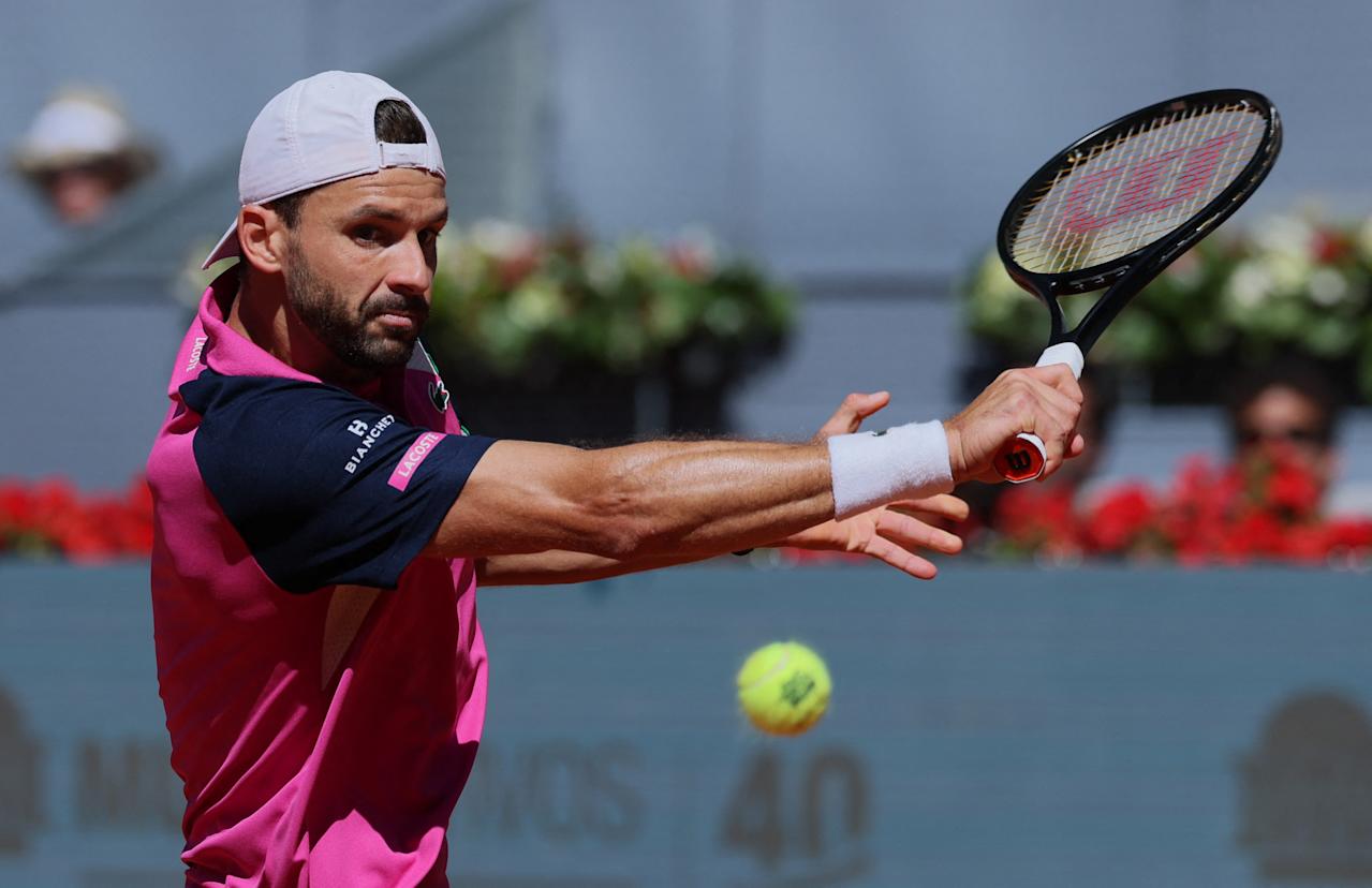 Bulgaria's Grigor Dimitrov returns the ball to Britain's Jacob Fearnley during their 2025 ATP Tour Madrid Open tennis tournament third round singles match at the Caja Magica in Madrid, on April 28, 2025. (Photo by Thomas COEX / AFP) (Photo by THOMAS COEX/AFP via Getty Images)