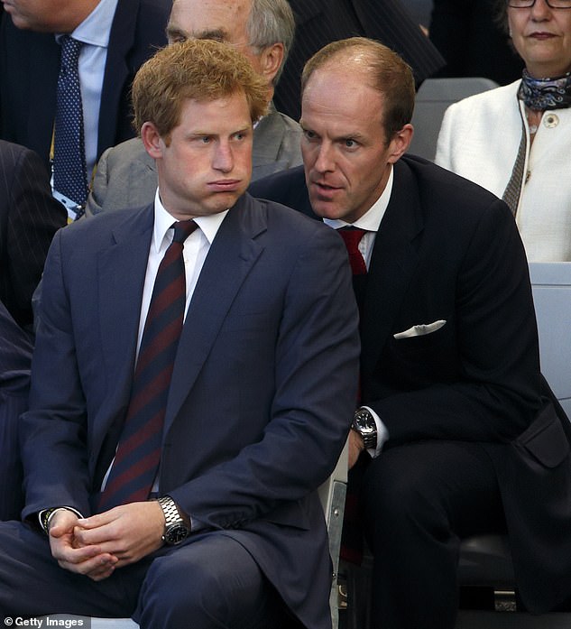 Edward Lane Fox whispers to Prince Harry at the opening of the Invictus Games in 2014