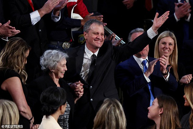 Marc Fogel, an American history teacher who was detained in Russia and Steve Witkoff, U.S. Special Envoy to the Middle East reacts during US President Donald Trump's speech to a joint session of Congress