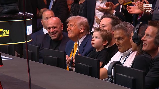 Trump took his cageside seat in between UFC chief Dana White and Elon Musk