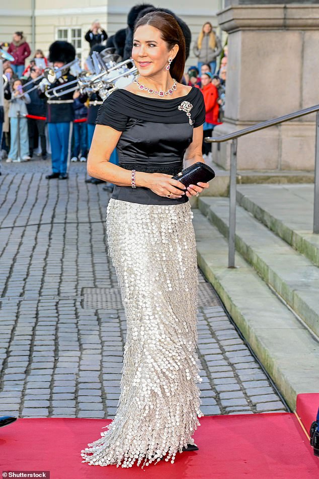 Mary was elegant as ever in an off-the-shoulder black and silver ensemble, with a glittering skirt and brooch catching the eye