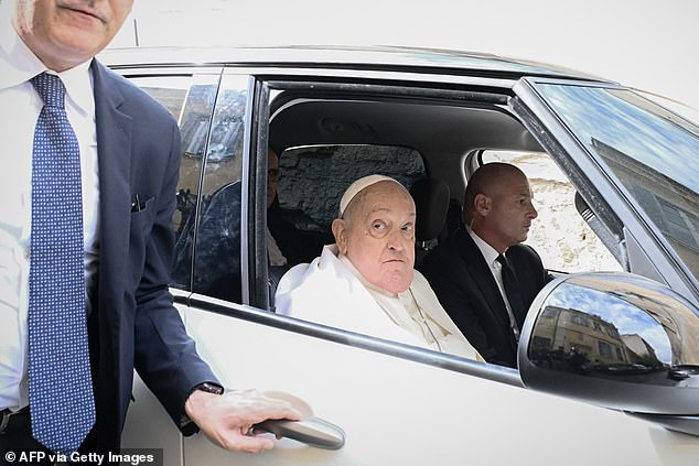 Pope Francis leaves after a private visit at the 'Regina Coeli' prison where he met around 70 inmates as part of the Holy Thursday celebrations in Rome