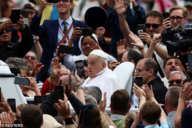 Pope Francis tours St. Peter's Square on the Pope mobile, as faithful react