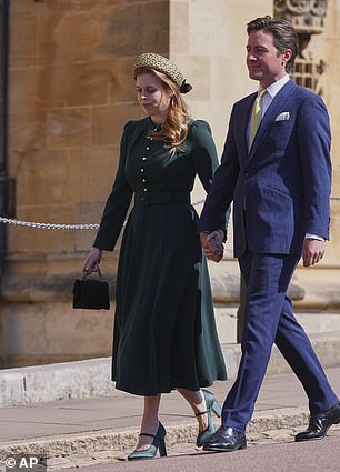 She completed her look with a pair of green satin heels