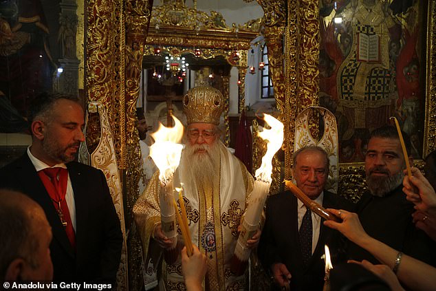 Orthodox Christians gather at the Church of the Nativity, where Jesus Christ is believed to have been born, to participate in the 'Easter Eve' ceremony, in Bethlehem, West Bank