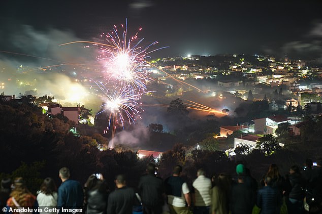 From the island's hilltops, spectators watched as thousands of fireworks lit up the night during the traditional Easter "rocket war" in Vrontados, Chios, Greece on April 20