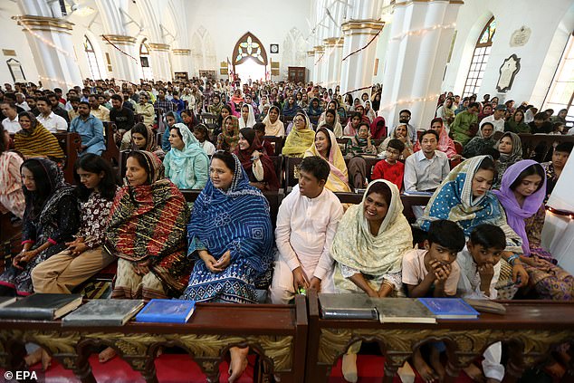 Members of the Christian minority community pray during Easter Sunday at St. John's Cathedral Church in Peshawar, Pakistan, 20 April 2025