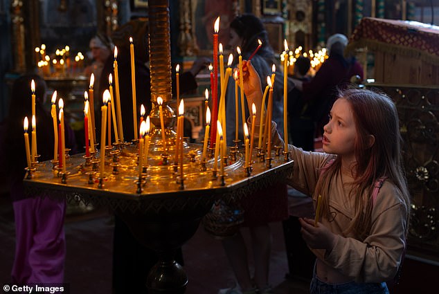 Candles are lit in Orthodox churches in Ukraine in memory of the dead on April 20, 2025 in Kharkiv, Ukraine