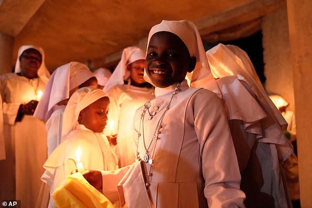 Stunning photos showed nuns draped in their white robes while holding lit candles in their hands