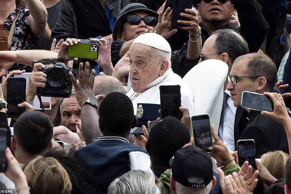 Thousands of faithful crowded around the Pope mobile to catch a glimpse of the pontiff