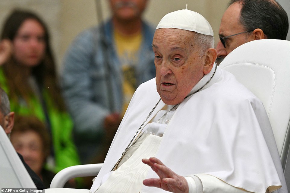 Pope Francis waves to the crowd from the popemobile after the Easter mass