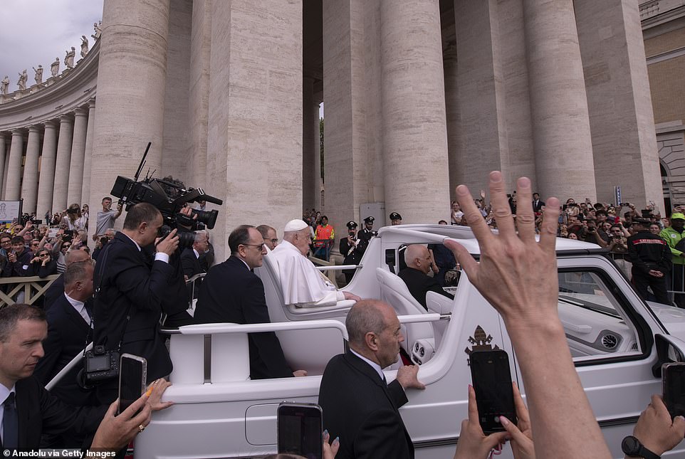 Pope Francis greets the faithful at the end of the Easter Mass led by Cardinal Angelo Comastri