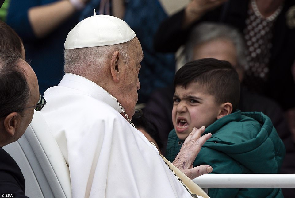 Pope Francis greets the faithful after the Urbi et Orbi blessing following the Easter Mass in Saint Peter's Square