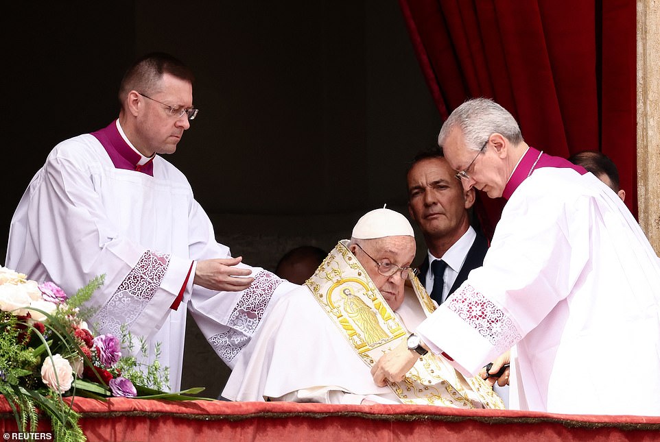 Pope Francis appears on a balcony on the day the "Urbi et Orbi" (to the city and to the world) message is delivered
