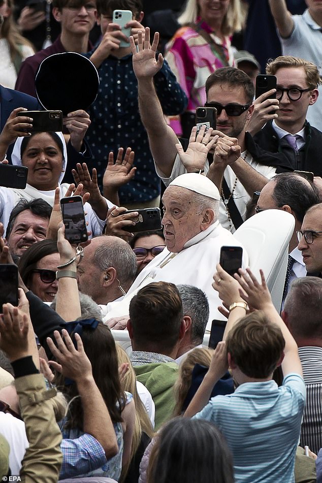 Pope Francis greets the faithful after the Urbi et Orbi blessing following the Easter Mass in Saint Peter's Square in Vatican City yesterday