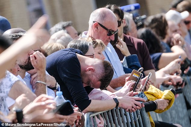 Catholics bow their heads as they gather at St Peter's Square on Easter Monday following the death of Pope Francis