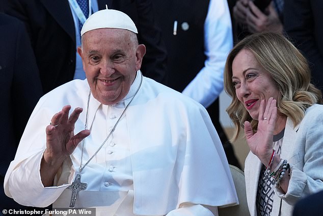 Pope Francis and Georgia Meloni wave to the crowd at the G7 summit in Puglia, Italy, in June last year