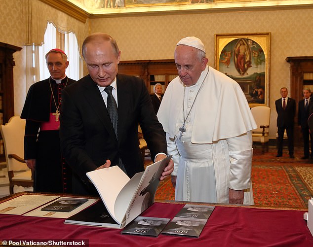 Vladimir Putin receives an audience with Pope Francis during a visit to Italy in July 2019