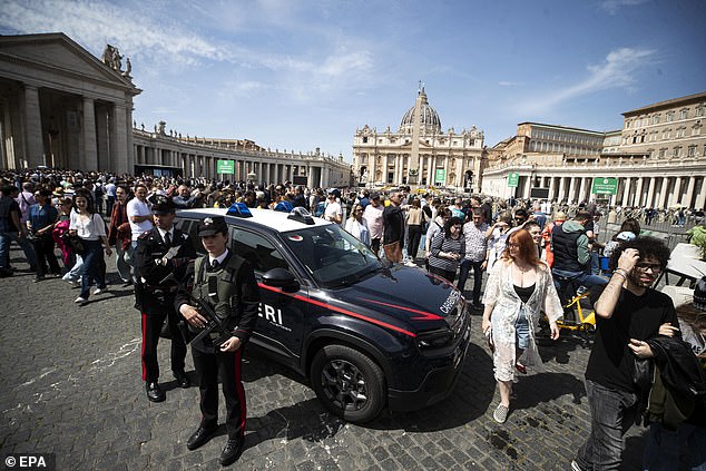 Police personnel stand guard in St. Peter's Square today following the death of Pope Francis