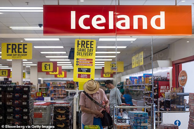 The store also offers employment to some prisoners as they near the end of their sentences, to help ease their route back into the world of work following their release. Pictured: shoppers inside an Iceland in Ipswich UK (not the in-prison store)