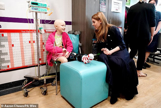 Princess Beatrice beamed as she conversed with patients at University College Hospital in London