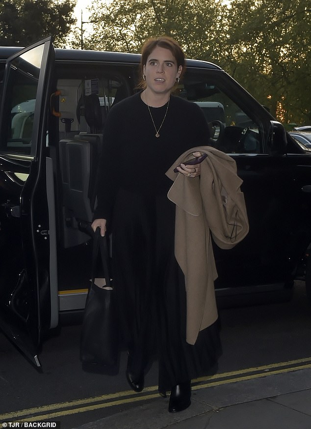 The royal turned heads in a black wool jumper, a black maxi satin skirt and a pair of chunky-heeled leather boots