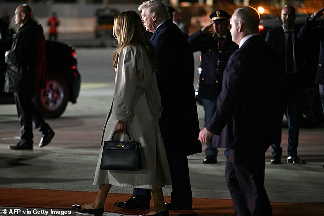 US President Donald Trump and First Lady Melania Trump walk to their limousine upon arrival at Leonardo da Vinci International Airport in Rome on April 25, 2025