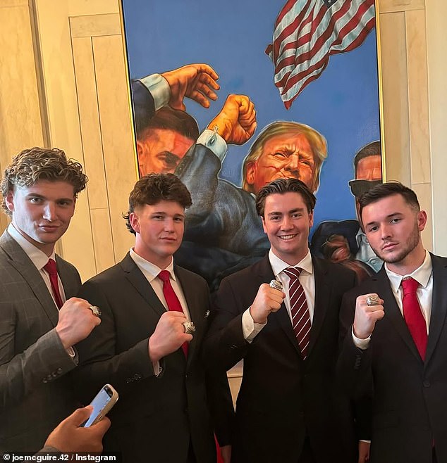Joe McGuire, second from right, with his teammates and their national championship rings