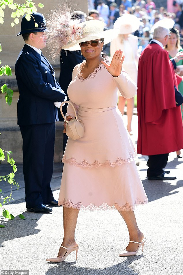 Prince Harry dubbed Oprah Winfrey (pictured at his wedding to Meghan in May 2019) his 'fairy godmother'