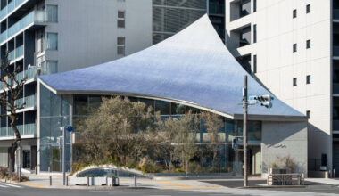 canopy of 28,000 tiles sweeps over yuko nagayama's café in japan