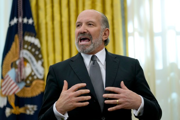 Commerce Secretary nominee Howard Lutnick speaks in the Oval Office of the White House after President Donald Trump signed an executive order, Thursday, Feb. 13, 2025, in Washington.