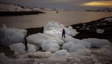 A child walks on top of pieces of ice in Nuuk, Greenland on Feb. 16, 2025. (Emilio Morenatti/AP)