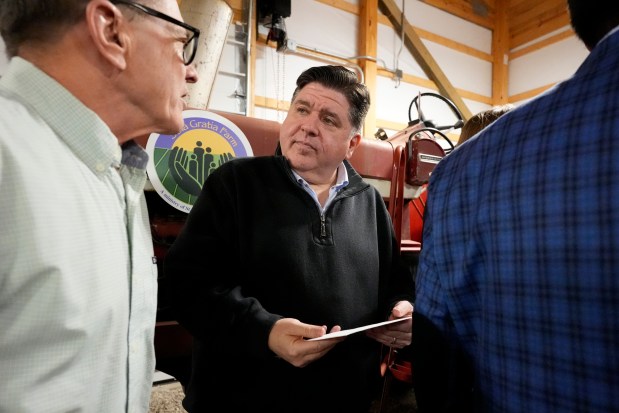 Illinois Gov. JB Pritzker meets with farmers in Urbana, Ill. last month. 