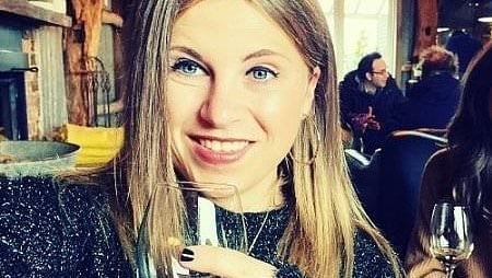 British woman dies after running through a glass door and severing her arm 'after an argument with her boyfriend'