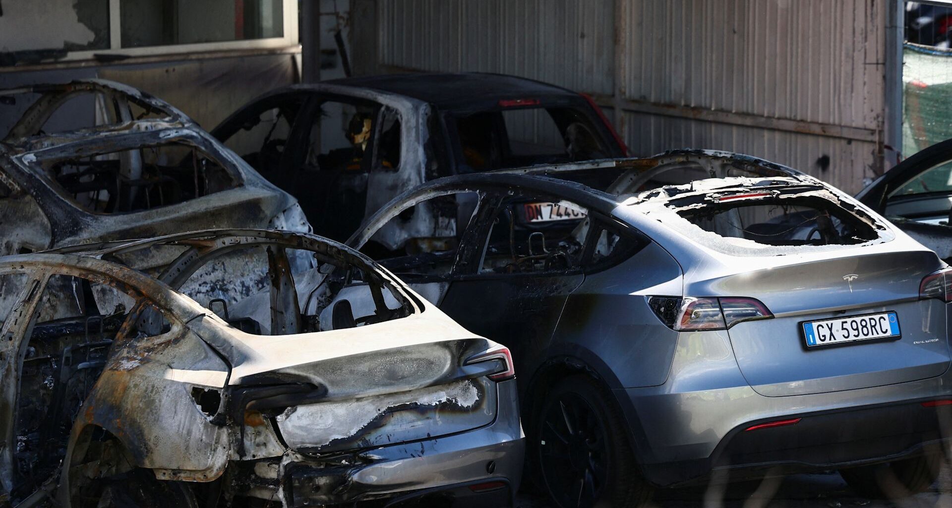 Investigators in Italy and France are probing possible arson attacks on Tesla property, which come amid global protests against the company.