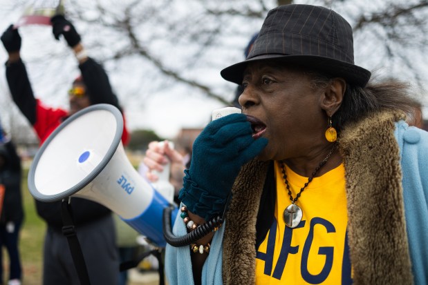 Mary Ross Cunningham chants during an American Federation of Government Employees Local 2107 press conference and rally outside of Captain James A. Lovell Federal Health Care Center to protest attacks on the federal workforce on April 4, 2025, in North Chicago. "We're under attack right now," Cunningham said. "We already went through this years ago." Cunningham said she went to Washington D.C. in 1966 to protest the same issues. (Audrey Richardson/Chicago Tribune)